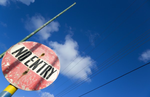 WEST INDIES, St Vincent & The Grenadines, Union Island, Colourful and weather worn No Entry road