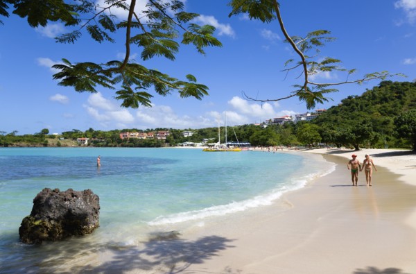 WEST INDIES, Grenada, St George, Gentle waves on BBC Beach in Morne Rouge Bay with tourists in the