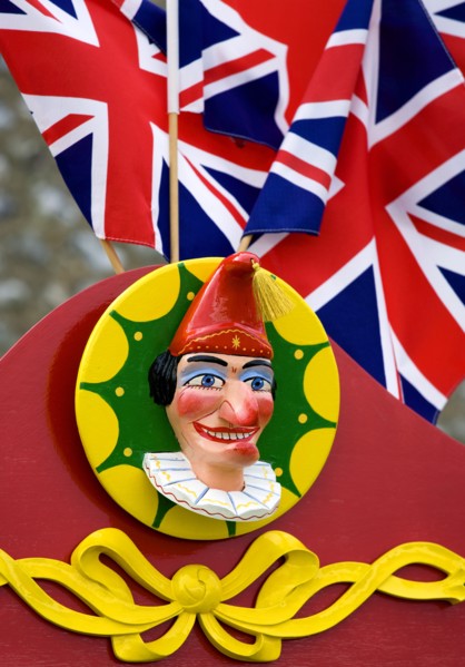 ENGLAND, West Sussex, Findon, Findon village Sheep Fair Bright red Punch and Judy stand with Union
