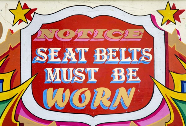 ENGLAND, West Sussex, Findon, Findon village Sheep Fair Colourful red sign on a fairground ride