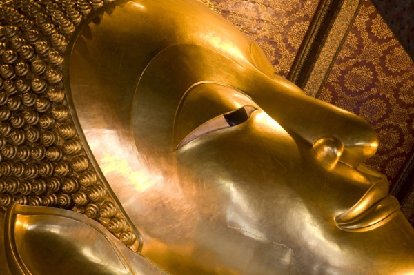 THAILAND, Central, Bangkok, Wat Pho also known as Wat Phra Chetuphon. Close up of the face of the