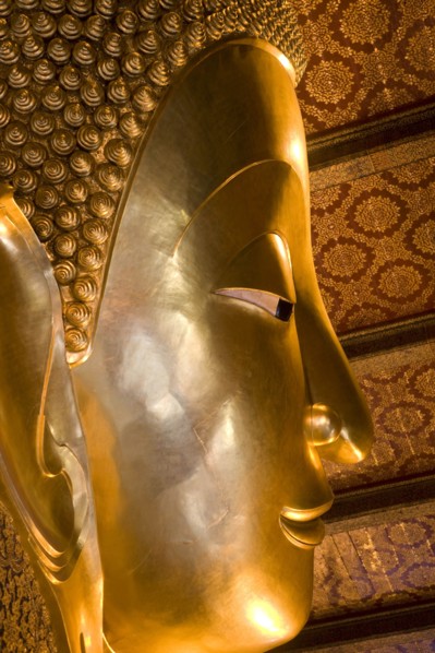 THAILAND, Central, Bangkok, Wat Pho also known as Wat Phra Chetuphon. Close up of the face of the