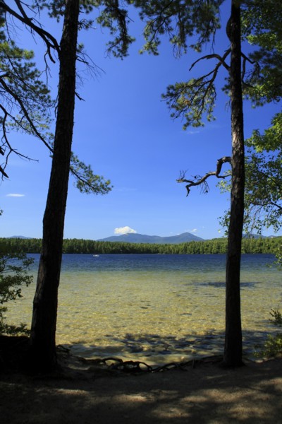 USA, New Hampshire, Tamworth, White Lake Campground with clear shallow water in the foreground.