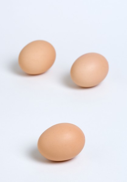 FOOD, Uncooked, Eggs, Three free range eggs on a white background.