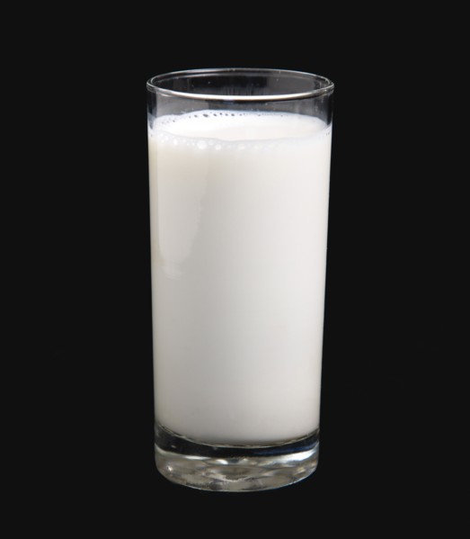 DRINK, Milk, Glass, Tumbler glass of dairy milk on a black background.