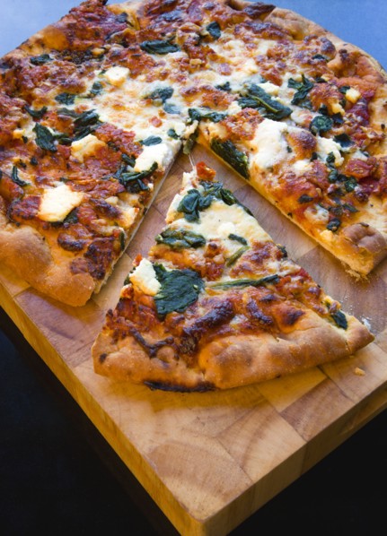 Food, Cooked, Pizza, Italian spinach and ricotta cheese pizza on wooden cutting board with a slice