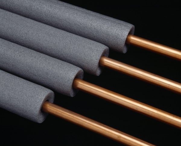 Architecture, Materials, Plumbing, Copper pipes with grey foam pipe lagging.