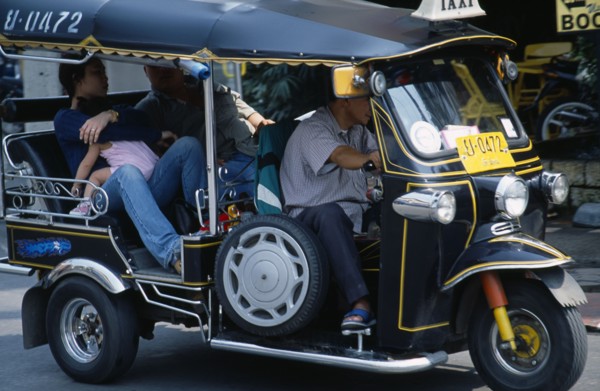 Thailand, North, Chiang Mai, Local family with young child as passengers in a Tuk Tuk three wheeled