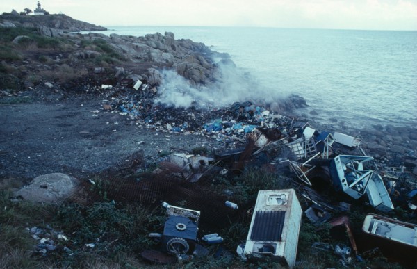 Pollution, Environment, Dumped fridges at watersedge releasing CFC gases into the atmosphere, along