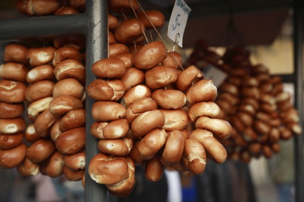 Poland, Krakow, Bread rolls for sale from street vendor's stall.