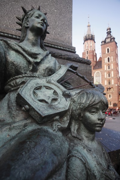 Poland, Krakow, Detail of female figure & child on monument to the polish romantic poet Adam