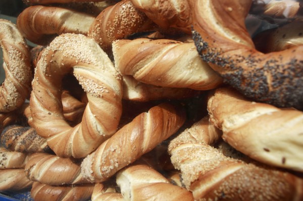 Poland, Krakow, Obwarzaneck, twisted rings of bread strewn with poppy sale, for sale from street