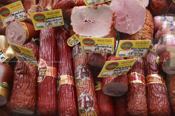 Poland, Krakow, display of cold meats in Stary Kleparz market.