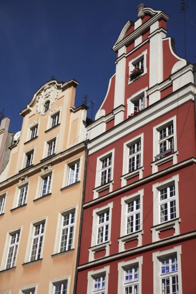 Poland, Wroclaw, pastel coloured building facades in the Rynek old town square.