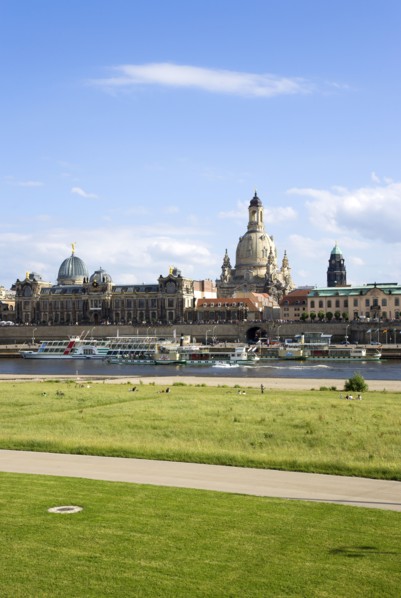 GERMANY, Saxony, Dresden, The city skyline with cruise boats moored on the River Elbe in front of
