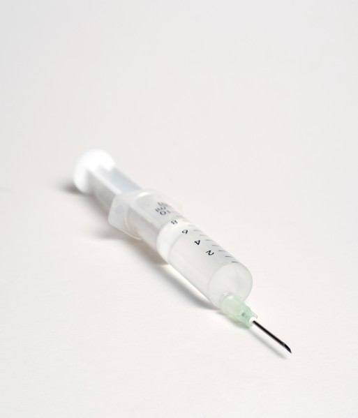 Health, Medicine, Medical Instruments, Hypodermic syringe with needle on a white background.