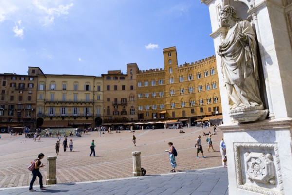 ITALY, Tuscany, Siena, A religious carving on the entrance portico of the Gothic Palazzo Publico
