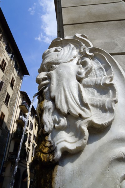 ITALY, Tuscany, Florence, Santa Croce District Drinking water fountain in the form of a male head