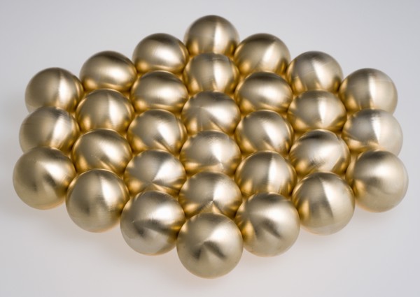 Industry, Machinery, Components, Brass metal lathe turned ball bearings arranged in a hexagon shape