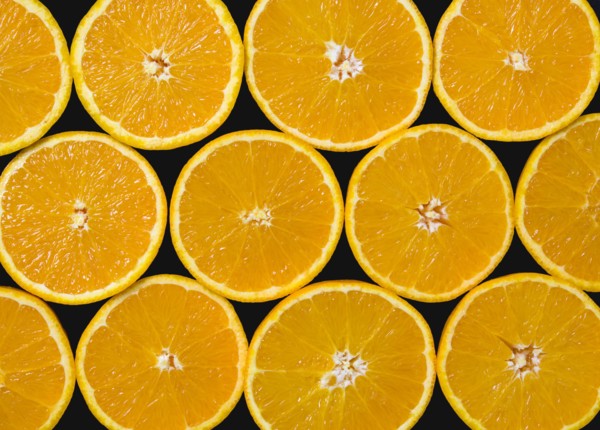 Food, Fruit, Oranges, Overhead view of group of oranges cut in half showing core and segments