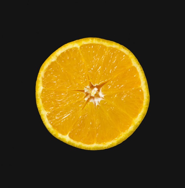 Food, Fruit, Oranges, One single ripe orange cut in half showing core and segments against a black