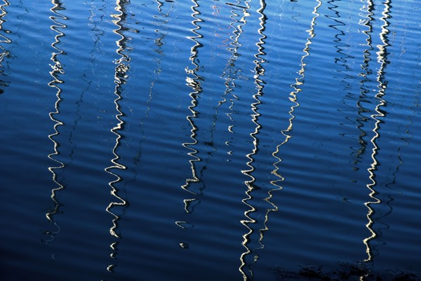 IRELAND, County Dublin, Howth Harbour, Reflection of yachts in the water.