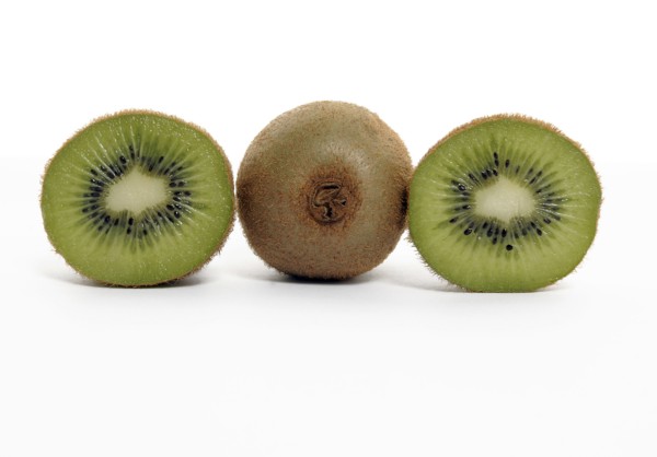 FOOD, Fruit, Kiwifruit, Whole and section through kiwi showing seeds and flesh.