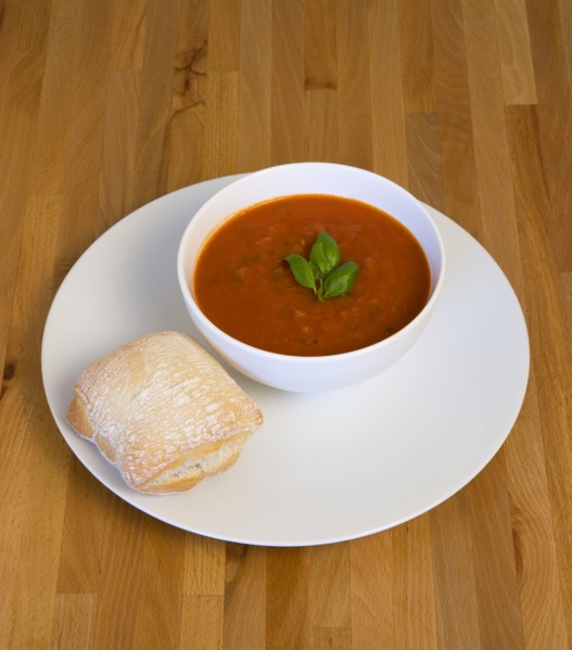 Food, Cooked, Soup, Bowl of tomato and basil soup on a plate with a rustic bread roll on a wooden