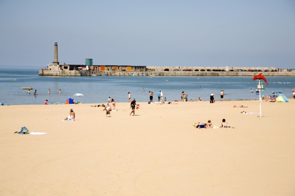 England, Kent, Margate beach with sunbathers.