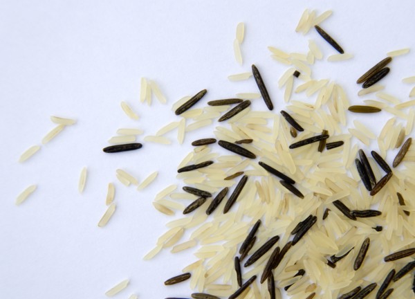 Food, Uncooked, Rice, Wild and basmati rice scattered on a white surface.