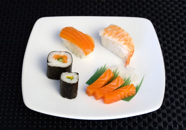 Food; Sushi; Meal; Sushi plate with rice wrapped in seaweed and seafood and fish selection.