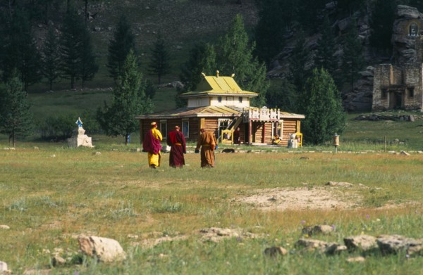 Mongolia, Kentii province, Baldan Baraivan, Monks walking through fields towards the temple.