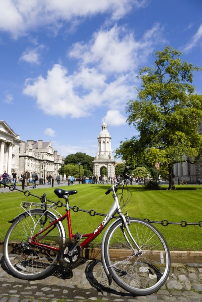 Ireland, County Dublin, Dublin City, Trinity College university with people walking through