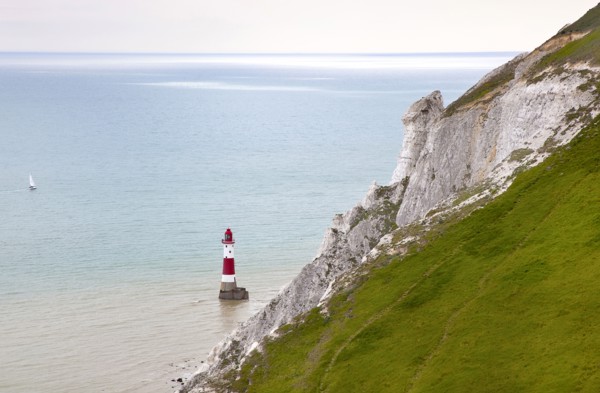 Eastbourne, East Sussex, England. Beachy Head view of the lighthouse at the base of the chalk