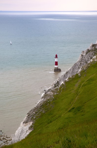 Eastbourne, East Sussex, England. Beachy Head view of the lighthouse at the base of the chalk