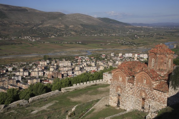 Berat, Albania. St Triada Church on the right with Berat new town beside the River Osum in the