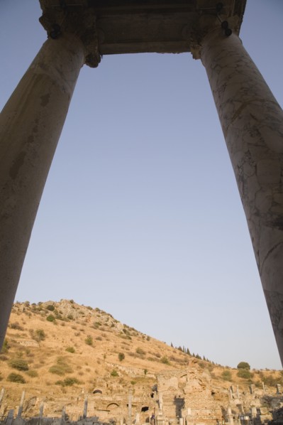 Selcuk, Izmir Province, Turkey. Ephesus. Pair of marble columns supporting roof framing ruins