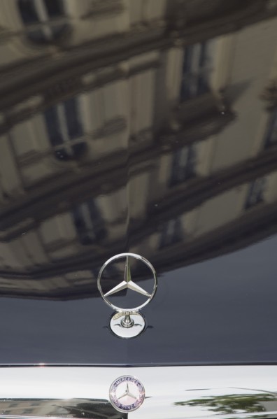 Vienna, Austria. Building facade reflected in bonnet of Mercedes car. Austria Austrian Republic