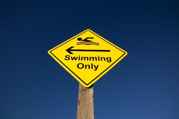 Shoreham-by-Sea, West Sussex, England. Sign indicating stretch of beach suitable for safe swimming.