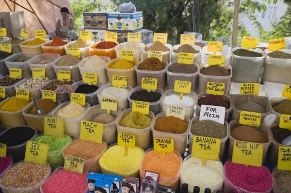 Kusadasi, Aydin Province, Turkey. Stall at weekly market selling spices and tea powders in brightly