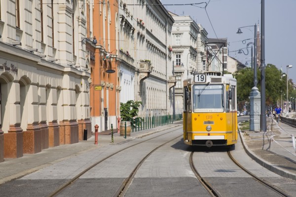 Budapest, Pest County, Hungary. Tram on bank of the River Danube Buda at approach to Chain Bridge.