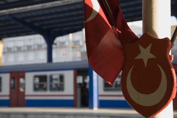 Istanbul, Turkey. Sultanahmet. Istanbul Sirkeci Terminal Turkish flag and emblem in foreground with