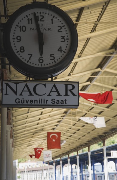 Istanbul, Turkey. Sultanahmet. Station clock giving time of three minutes to six on platform with