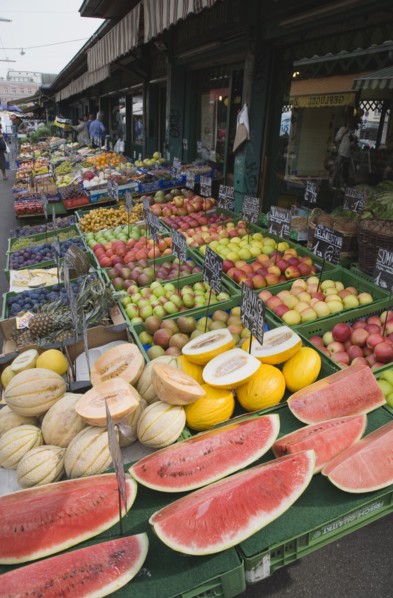 Vienna, Austria. The Naschmarkt. Display of fresh fruit for sale on stall outside shopfront