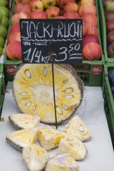 Vienna, Austria. The Naschmarkt. Jack Fruit for sale on fruit stall cut in half and into wedges.