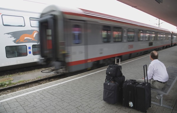 Vienna, Austria. Wien Westbahnhof. Passenger with luggage sitting on Vienna West Station with