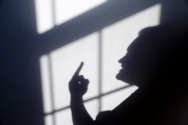 Shadow of a person giving a hand gesture Flipping the Bird. Anger Angry Annoyed Day Daytime Gesture