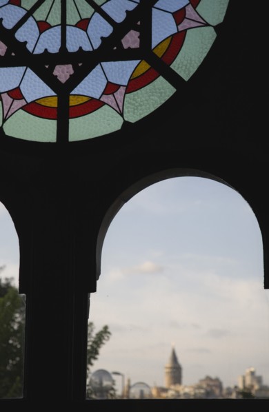 Istanbul, Turkey. Sultanahmet. Part view of dirty stained glass window in Ottoman era waiting room