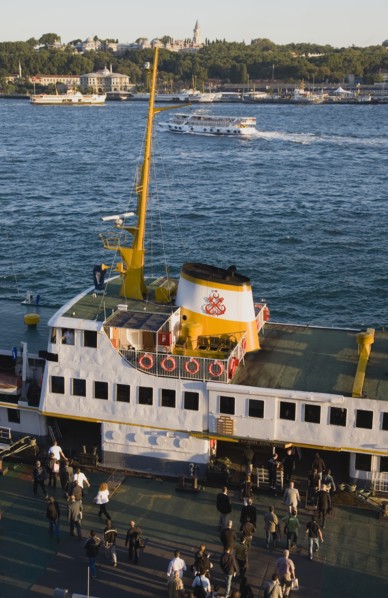 Istanbul, Turkey. Sultanahmet Bosphorous passenger ferry at sunset with people boarding. Turkey