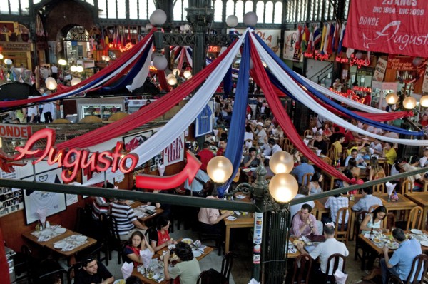 Santiago, Chile. Seafood restaurant section of Central Market with diners at tables eating under